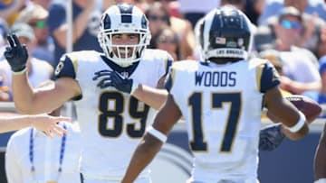 LOS ANGELES, CA - SEPTEMBER 23: Tyler Higbee #89 of the Los Angeles Rams celebrates his first down catch with teammate Robert Woods #17 during the second quarter of the game against the Los Angeles Chargers at Los Angeles Memorial Coliseum on September 23, 2018 in Los Angeles, California. (Photo by Harry How/Getty Images)