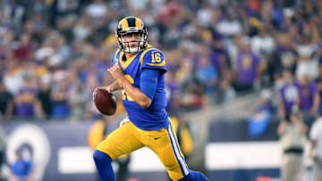 LOS ANGELES, CA - SEPTEMBER 27: Jared Goff #16 of the Los Angeles Rams rolls out of the pocket to throw a touchdown pass for a 21-17 lead over the Minnesota Vikings during the second quarter at Los Angeles Memorial Coliseum on September 27, 2018 in Los Angeles, California. (Photo by Harry How/Getty Images)