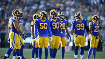 LOS ANGELES, CA - NOVEMBER 11: Ndamukong Suh #93, Samson Ebukam #50, Michael Brockers #90, Mark Barron #26, Aaron Donald #99 and Marcus Peters #22 of the Los Angeles Rams get ready to face the Seattle Seahawks offence at Los Angeles Memorial Coliseum on November 11, 2018 in Los Angeles, California. (Photo by John McCoy/Getty Images)