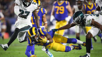 LOS ANGELES, CA - DECEMBER 16: Running back Todd Gurley #30 of the Los Angeles Rams makes a run play in the second quarter in front of cornerback Rasul Douglas #32 of the Philadelphia Eagles at Los Angeles Memorial Coliseum on December 16, 2018 in Los Angeles, California. (Photo by Sean M. Haffey/Getty Images)
