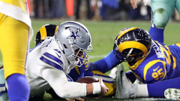 LOS ANGELES, CA - JANUARY 12: Dak Prescott #4 of the Dallas Cowboys runs for a 1 yard touchdown late in the fourth quarter against the Los Angeles Rams in the NFC Divisional Playoff game at Los Angeles Memorial Coliseum on January 12, 2019 in Los Angeles, California. (Photo by Sean M. Haffey/Getty Images)