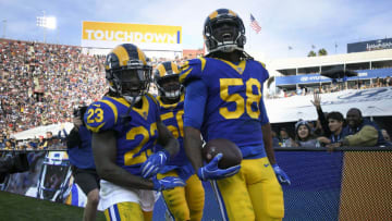 LOS ANGELES, CA - DECEMBER 30: Cory Littleton #58 celebrates scoring a touchdown scored after an interception with Samson Ebukam #50 and Nickell Robey-Coleman at Los Angeles Memorial Coliseum on December 30, 2018 in Los Angeles, California. Rams won 48-32. (Photo by John McCoy/Getty Images)
