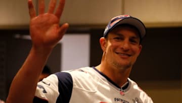 ATLANTA, GEORGIA - JANUARY 30: Rob Gronkowski #87 of the New England Patriots waves as he walks into the New England Patriots Super Bowl LIII media availability at the Hyatt Regency Atlanta on January 30, 2019 in Atlanta, Georgia. (Photo by Kevin C. Cox/Getty Images)