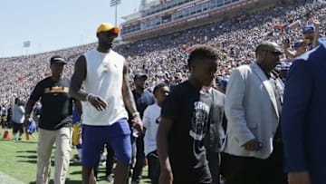 LOS ANGELES, CA - SEPTEMBER 18: NBA player LeBron James of the Cleveland Cavaliers walks on the field during the home opening NFL game between the Los Angeles Rams and the Seattle Seahawks at Los Angeles Coliseum on September 18, 2016 in Los Angeles, California. (Photo by Jeff Gross/Getty Images)