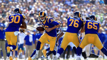 LOS ANGELES, CA - OCTOBER 08: Jared Goff #16 hands off to Todd Gurley #30 as Rodger Saffold #76 and John Sullivan #65 of the Los Angeles Rams block uring the second half of a game against the Seattle Seahawks at Los Angeles Memorial Coliseum on October 8, 2017 in Los Angeles, California. (Photo by Sean M. Haffey/Getty Images)