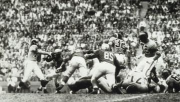 LOS ANGELES, CA - NOVEMBER 1: Quarterback Norm Van Brocklin #11 of the Los Angeles Rams throws a pass against the Detroit Lions on November 1, 1953 at the Los Angeles Memorial Coliseum in Los Angeles, California. The Rams defeated the Lions 37-34. (Photo by Vic Stein/Getty Images)