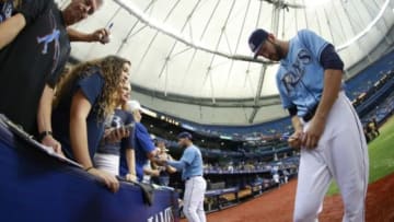 Oct 4, 2015; St. Petersburg, FL, USA; Tampa Bay Rays right fielder Steven Souza Jr. (20) and center fielder Kevin Kiermaier (39) sign autographs for fans before the game against the Toronto Blue Jays at Tropicana Field. Mandatory Credit: Kim Klement-USA TODAY Sports