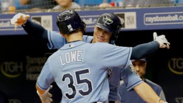 ST. PETERSBURG, FL SEPTEMBER 9: Brandon Lowe #35 of the Tampa Bay Rays hugs teammate Willy Adames #1 after hitting a three-run home run in the first inning of the game against the Baltimore Orioles at Tropicana Field on September 9, 2018 in St. Petersburg, Florida. (Photo by Joseph Garnett Jr./Getty Images)