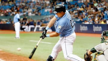 ST. PETERSBURG, FL SEPTEMBER 16: Ji-Man Choi #26 of the Tampa Bay Rays connects with the ball and grounded out to first base during the seventh inning of the game against the Oakland Athletics at Tropicana Field on September 16, 2018 in St. Petersburg, Florida. (Photo by Joseph Garnett Jr./Getty Images)
