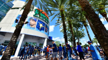 ST PETERSBURG, FLORIDA - MARCH 28: Fans line up outside of Tropicana field during Opening Day before a baseball game between the Tampa Bay Rays and the Houston Astros on March 28, 2019 in St Petersburg, Florida. (Photo by Julio Aguilar/Getty Images)