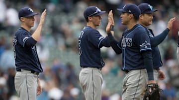 SEATTLE, WA - AUGUST 11: (L-R) Ryan Yarbrough #48 of the Tampa Bay Rays, Matt Duffy #5, Avisail Garcia #24 and Ji-Man Choi #26 celebrate after a game against the Seattle Mariners at T-Mobile Park on August 11, 2019 in Seattle, Washington. The Rays won the game 1-0. (Photo by Stephen Brashear/Getty Images)