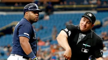 ST. PETERSBURG, FL - AUGUST 21 : Home plate umpire John Libka tosses Jesus Aguilar #21 of the Tampa Bay Rays from the game after and exchange of words after a strike-three call during the bottom of the sixth inning of the game against the Seattle Mariners at Tropicana Field on August 21, 2019 in St. Petersburg, Florida. (Photo by Joseph Garnett Jr. /Getty Images)