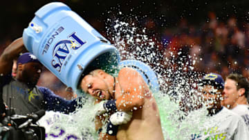 ST PETERSBURG, FLORIDA - SEPTEMBER 21: Nate Lowe #35 of the Tampa Bay Rays gets a water cooler bath after a 2-run walk-off against the Boston Red Sox in the eleventh inning of a baseball game at Tropicana Field on September 21, 2019 in St Petersburg, Florida. (Photo by Julio Aguilar/Getty Images)