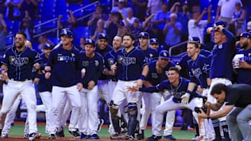 ST PETERSBURG, FLORIDA - SEPTEMBER 24: Ji-Man Choi #26 of the Tampa Bay Rays celebrates a walk off home run in the 12th inning during a game against the New York Yankees at Tropicana Field on September 24, 2019 in St Petersburg, Florida. (Photo by Mike Ehrmann/Getty Images)