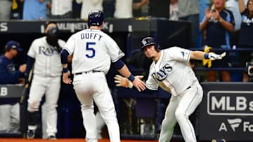ST PETERSBURG, FLORIDA - OCTOBER 07: Willy Adames #1 of the Tampa Bay Rays celebrates with Matt Duffy #5 after scoring a run against the Houston Astros during the fourth inning in Game Three of the American League Division Series at Tropicana Field on October 07, 2019 in St Petersburg, Florida. (Photo by Julio Aguilar/Getty Images)
