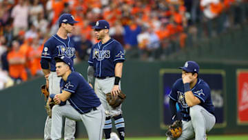 HOUSTON, TEXAS - OCTOBER 10: (L-R) Joey Wendle #18, Willy Adames #1, Eric Sogard #9 and Ji-Man Choi #26 react against the Houston Astros during the eighth inningin game five of the American League Division Series at Minute Maid Park on October 10, 2019 in Houston, Texas. (Photo by Bob Levey/Getty Images)