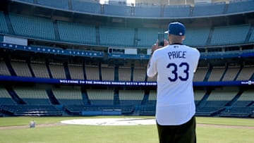 LOS ANGELES, CA - FEBRUARY 12: David Price #13 of the Los Angeles Dodgers takes a video as he stands on the pitchers mound after an introductory press conference at Dodger Stadium on February 12, 2020 in Los Angeles, California. (Photo by Jayne Kamin-Oncea/Getty Images)