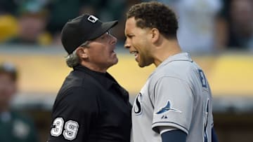 OAKLAND, CA - AUGUST 22: James Loney #21 of the Tampa Bay Rays argues with home plate umpire Paul Nauert #39 after Nauert threw Loney out of the game against the Oakland Athletics in the top of the six inning at O.co Coliseum on August 22, 2015 in Oakland, California. (Photo by Thearon W. Henderson/Getty Images)