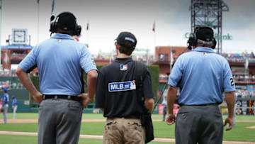 PHILADELPHIA, PA - JULY 3: Umpires review a call with the assistance of an MLB.TV technician in the fourth inning during a game between the Philadelphia Phillies and Kansas City Royals at Citizens Bank Park on July 3, 2016 in Philadelphia, Pennsylvania. The Phillies won 7-2. (Photo by Hunter Martin/Getty Images) *** Local Caption ***