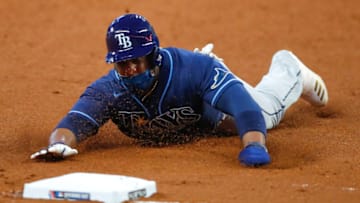 ATLANTA, GA - JULY 29: Yandy Diaz #2 of the Tampa Bay Rays slides into third in the sixth inning of an MLB game against the Atlanta Braves at Truist Park on July 29, 2020 in Atlanta, Georgia. (Photo by Todd Kirkland/Getty Images)