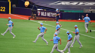 ST PETERSBURG, FLORIDA - JULY 09: Tampa Bay Rays players warm up during a summer workout at Tropicana Field on July 09, 2020 in St Petersburg, Florida. (Photo by Julio Aguilar/Getty Images)