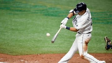 ST PETERSBURG, FLORIDA - JULY 24: Yoshitomo Tsutsugo #25 of the Tampa Bay Rays hits a two run home run during the fifth inning against the Toronto Blue Jays on Opening Day at Tropicana Field on July 24, 2020 in St Petersburg, Florida. The 2020 season had been postponed since March due to the COVID-19 pandemic. (Photo by Douglas P. DeFelice/Getty Images)