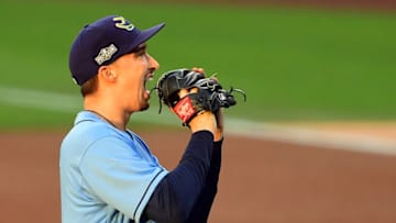 Oct 11, 2020; San Diego, California, USA; Tampa Bay Rays starting pitcher Blake Snell (4) reacts and bites his glove after walking Houston Astros first baseman Yuli Gurriel (10) during the fourth inning in game one of the 2020 ALCS at Petco Park. Mandatory Credit: Jayne Kamin-Oncea-USA TODAY Sports