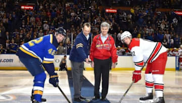 Jan 14, 2016; St. Louis, MO, USA; St. Louis Blues center David Backes (42) and Carolina Hurricanes center Eric Staal (12) face off as St. Louis Cardinals President Bill Dewitt III. (L) and St. Louis Blues chairmen Tom Stillman (R) drop the puck before the game at Scottrade Center. Mandatory Credit: Jasen Vinlove-USA TODAY Sports