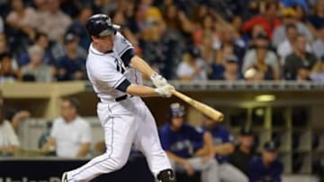 Sep 9, 2015; San Diego, CA, USA; San Diego Padres shortstop Jedd Gyorko (9) hits a three run home run during the third inning against the Colorado Rockies at Petco Park. Mandatory Credit: Jake Roth-USA TODAY Sports