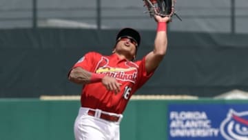 Mar 21, 2016; Jupiter, FL, USA; St. Louis Cardinals second baseman Kolten Wong (16) makes a catch against the Boston Red Sox during the game at Roger Dean Stadium. The Red Sox defeated the Cardinals 4-3. Mandatory Credit: Scott Rovak-USA TODAY Sports