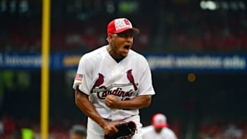 Jul 4, 2016; St. Louis, MO, USA; St. Louis Cardinals starting pitcher Carlos Martinez (18) reacts as he walks off the field after giving up a one run single to Pittsburgh Pirates first baseman John Jaso (not pictured) during the seventh inning at Busch Stadium. Mandatory Credit: Jeff Curry-USA TODAY Sports