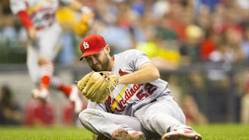Jul 8, 2016; Milwaukee, WI, USA; St. Louis Cardinals pitcher Michael Wacha (52) falls to the ground after being hit by the ball during the seventh inning against the Milwaukee Brewers at Miller Park. Mandatory Credit: Jeff Hanisch-USA TODAY Sports