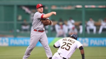 Jun 11, 2016; Pittsburgh, PA, USA; St. Louis Cardinals second baseman Jedd Gyorko (3) turns a double play over Pittsburgh Pirates right fielder Gregory Polanco (25) during the fourth inning at PNC Park. Mandatory Credit: Charles LeClaire-USA TODAY Sports