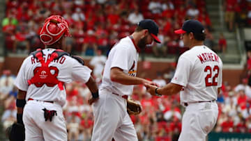 Jul 17, 2016; St. Louis, MO, USA; St. Louis Cardinals starting pitcher Michael Wacha (52) is removed from the game by manager Mike Matheny (22) during the fifth inning against the Miami Marlins at Busch Stadium. Mandatory Credit: Jeff Curry-USA TODAY Sports