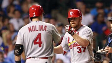 Aug 14, 2016; Chicago, IL, USA; St. Louis Cardinals first baseman Brandon Moss (37) celebrates with catcher Yadier Molina (4) after hitting a home run in the seventh inning against the Chicago Cubs at Wrigley Field. Mandatory Credit: Caylor Arnold-USA TODAY Sports