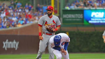 Aug 13, 2016; Chicago, IL, USA; Chicago Cubs first baseman Anthony Rizzo (44) is tagged out by St. Louis Cardinals first baseman Matt Carpenter (13) during the third inning at Wrigley Field. Mandatory Credit: Dennis Wierzbicki-USA TODAY Sports