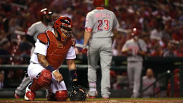 Sep 26, 2016; St. Louis, MO, USA; St. Louis Cardinals catcher Yadier Molina (4) looks on after Cincinnati Reds left fielder Adam Duvall (23) hits a solo home run off of starting pitcher Jaime Garcia (not pictured) during the first inning at Busch Stadium. Mandatory Credit: Jeff Curry-USA TODAY Sports