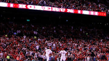 Sep 30, 2016; St. Louis, MO, USA; St. Louis Cardinals third base coach Chris Maloney (77) congratulates first baseman Brandon Moss (37) as he rounds third base after hitting a two run home run during the sixth inning against the Pittsburgh Pirates at Busch Stadium. Mandatory Credit: Scott Kane-USA TODAY Sports