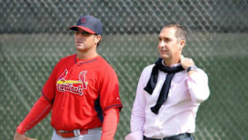 Feb 21, 2015; Jupiter, FL, USA; St. Louis Cardinals manager Mike Matheny (left) talks with Cardinals general manager John Mozeliak (right) during practice drills at Roger Dean Stadium. Mandatory Credit: Steve Mitchell-USA TODAY Sports