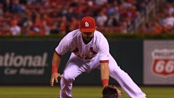 Sep 28, 2016; St. Louis, MO, USA; St. Louis Cardinals third baseman Matt Carpenter (13) makes a play against the Cincinnati Reds at Busch Stadium. Mandatory Credit: Scott Rovak-USA TODAY Sports