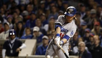 Oct 22, 2016; Chicago, IL, USA; Los Angeles Dodgers right fielder Josh Reddick (11) advances to first base on an error against the Chicago Cubs during the second inning of game six of the 2016 NLCS playoff baseball series at Wrigley Field. Mandatory Credit: Jon Durr-USA TODAY Sports