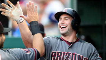 ARLINGTON, TX - AUGUST 13: Paul Goldschmidt #44 of the Arizona Diamondbacks celebrates after scoring on a RBI double hit by A.J. Pollock #11 of the Arizona Diamondbacks against the Texas Rangers in the top of the first inning at Globe Life Park in Arlington on August 13, 2018 in Arlington, Texas. (Photo by Tom Pennington/Getty Images)