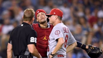 LOS ANGELES, CA - AUGUST 21: Interim Manager Mike Shildt #8 of the St. Louis Cardinals and Yadier Molina #4 argue a foul call with umpire Jim Wolf 8 during the fourth inning against the Los Angeles Dodgers at Dodger Stadium on August 21, 2018 in Los Angeles, California. (Photo by Harry How/Getty Images)