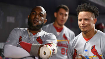 MIAMI, FL - JUNE 11: Marcell Ozuna #23 of the St. Louis Cardinals poses with Yairo Munoz #34 in the dugout after hitting a home run in the ninth inning against the Miami Marlins at Marlins Park on June 11, 2019 in Miami, Florida. (Photo by Mark Brown/Getty Images)