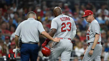 SAN DIEGO, CA - JUNE 28: Marcell Ozuna #23 of the St. Louis Cardinals leaves the game with a trainer as Mike Shildt #8 looks on during the third inning of a baseball game against the San Diego Padres at Petco Park June 28, 2019 in San Diego, California. (Photo by Denis Poroy/Getty Images)