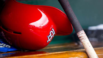 ST. LOUIS, MO - APRIL 28: A general shot of a St. Louis Cardinals helmet and a bat in the dugout during a game between the St. Louis Cardinals and the Milwaukee Brewers at Busch Stadium on April 28, 2012 in St. Louis, Missouri. The St. Louis Cardinals beat the Milwaukee Brewers 7-3. (Photo by David Welker/Getty Images)