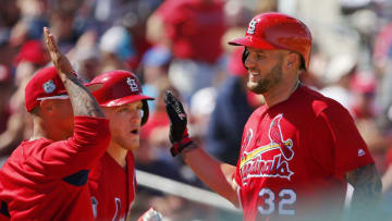 JUPITER, FL - MARCH 11: Matt Adams #32 of the St. Louis Cardinals is congratulated by teammates Kolten Wong #16 and Harrison Bader #88 after his home run in the fourth inning against the Atlanta Braves during a spring training baseball game at Roger Dean Stadium on March 11, 2017 in Jupiter, Florida. (Photo by Rich Schultz/Getty Images)
