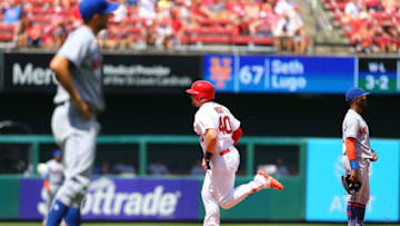 ST. LOUIS, MO - JULY 9: Luke Voit #40 of the St. Louis Cardinals rounds the bases after hitting a home run as Jose Reyes #7 of the New York Mets looks on in the sixth inning at Busch Stadium on July 9, 2017 in St. Louis, Missouri. (Photo by Dilip Vishwanat/Getty Images)