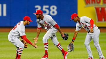 NEW YORK, NY - JULY 17: Tommy Pham #28, Dexter Fowler #25 and Magneuris Sierra #43 of the St. Louis Cardinals celebrate after defeating the New York Mets on July 17, 2017 at Citi Field in the Flushing neighborhood of the Queens borough of New York City. (Photo by Jim McIsaac/Getty Images)