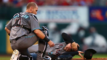 ST. LOUIS, MO - JULY 28: Chris Herrmann #10 of the Arizona Diamondbacks comes to the aid of pitcher Robbie Ray #38 of the Arizona Diamondbacks after he was hit in the head by a line drive against the St. Louis Cardinals in the second inning at Busch Stadium on July 28, 2017 in St. Louis, Missouri. (Photo by Dilip Vishwanat/Getty Images)